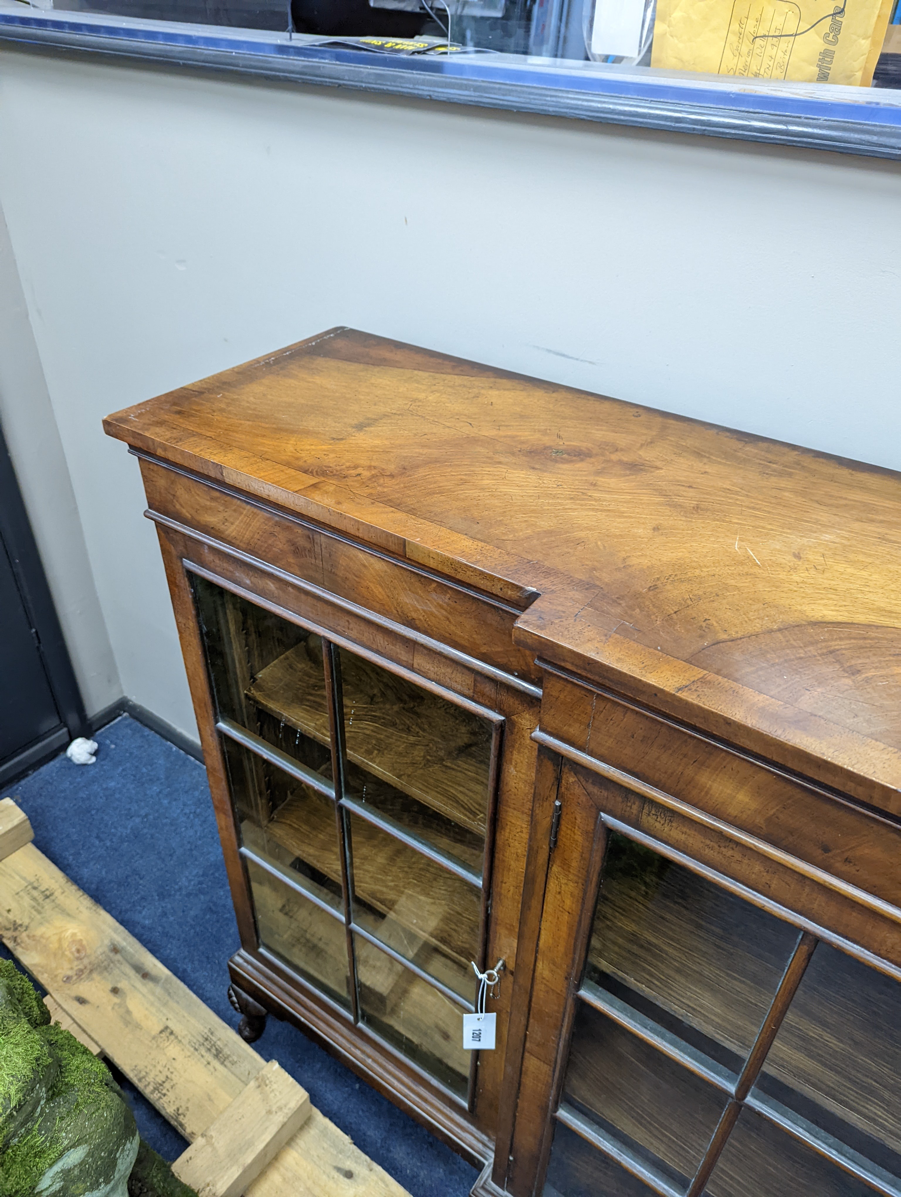 A Queen Anne revival walnut dwarf breakfront bookcase, length 182cm, depth 38cm, height 113cm